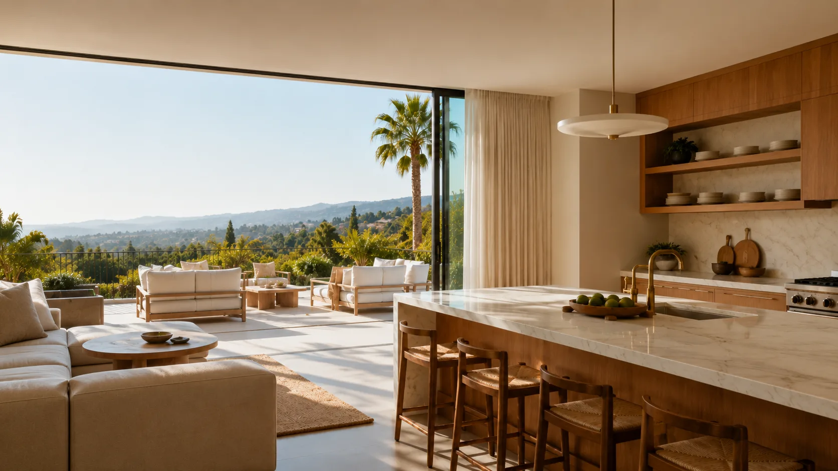 Open-concept Los Angeles kitchen and living room with a white marble waterfall island, white oak cabinetry, and a hillside canyon view through open floor-to-ceiling glass doors